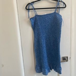 Blue form fitting midi dress.